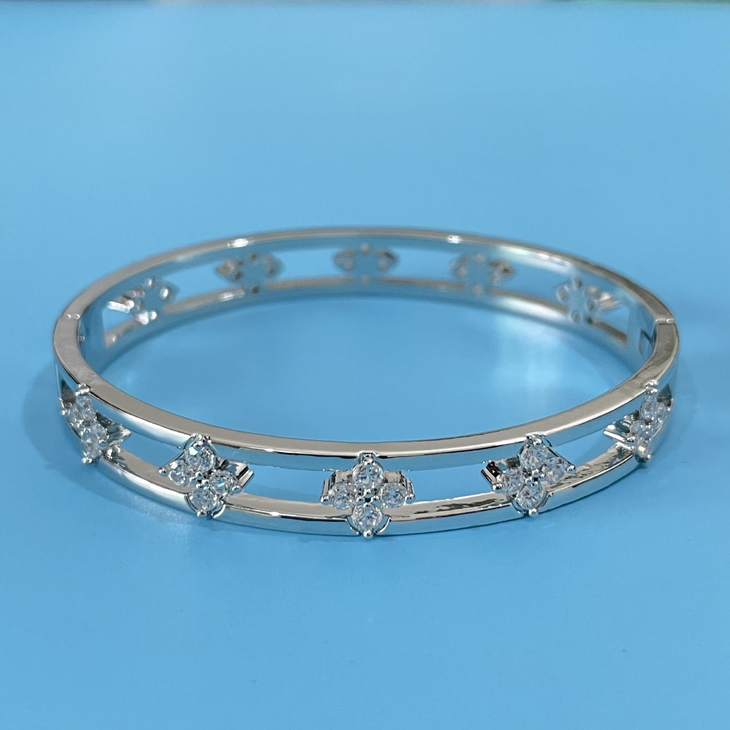 Floral Detail Bangle Bracelet with Elegant Openwork Design