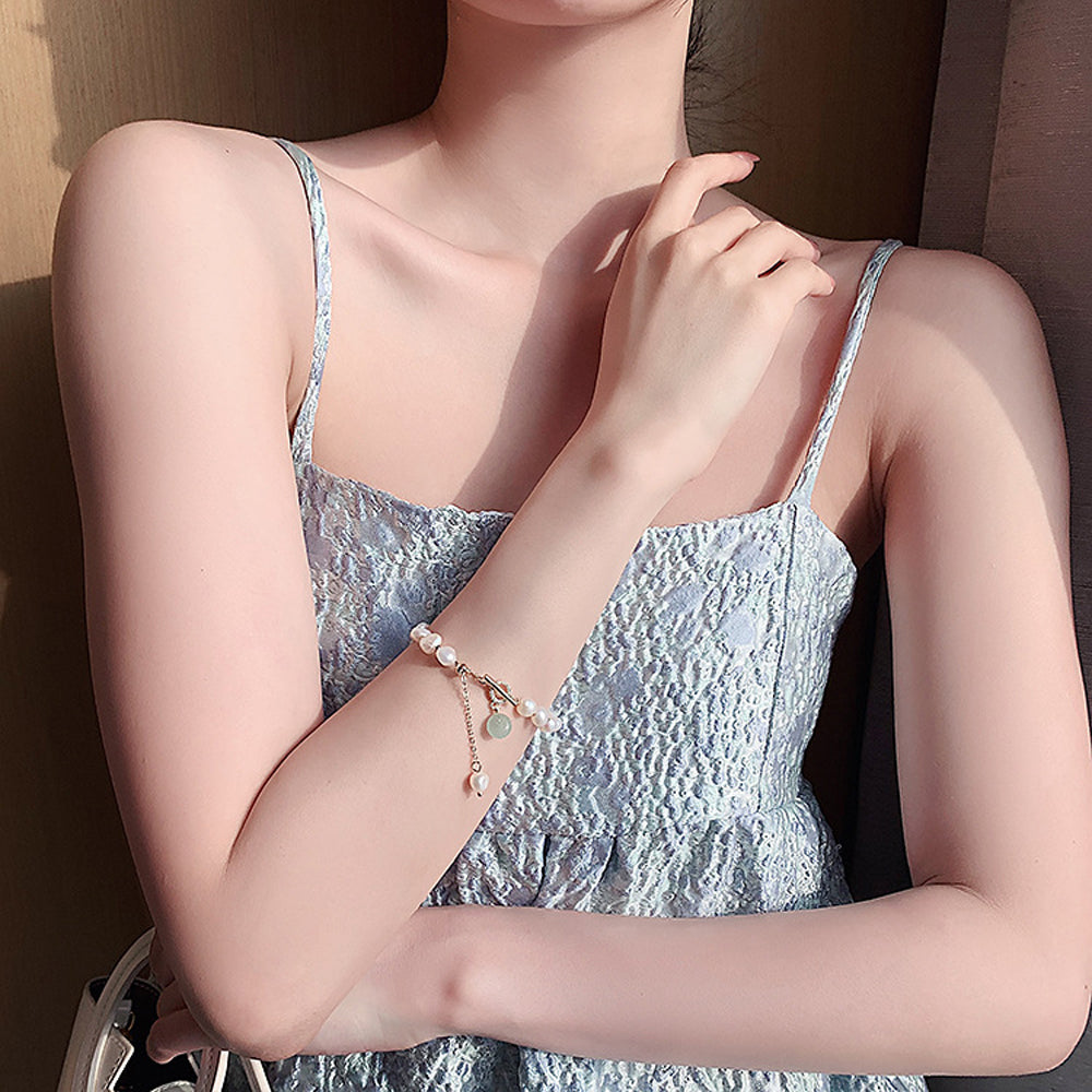 Elegant Freshwater Pearl Bracelet with Green Accent Charm
