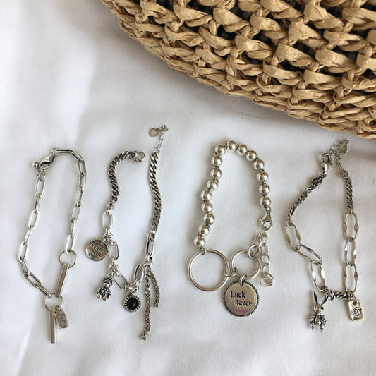 Mixed-Link Charm Bracelet with Contemporary Layered Style