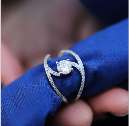 Infinity Sparkle Swirl Solitaire Ring