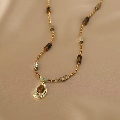 Vintage Gold Beaded Necklace with Teardrop Pendant