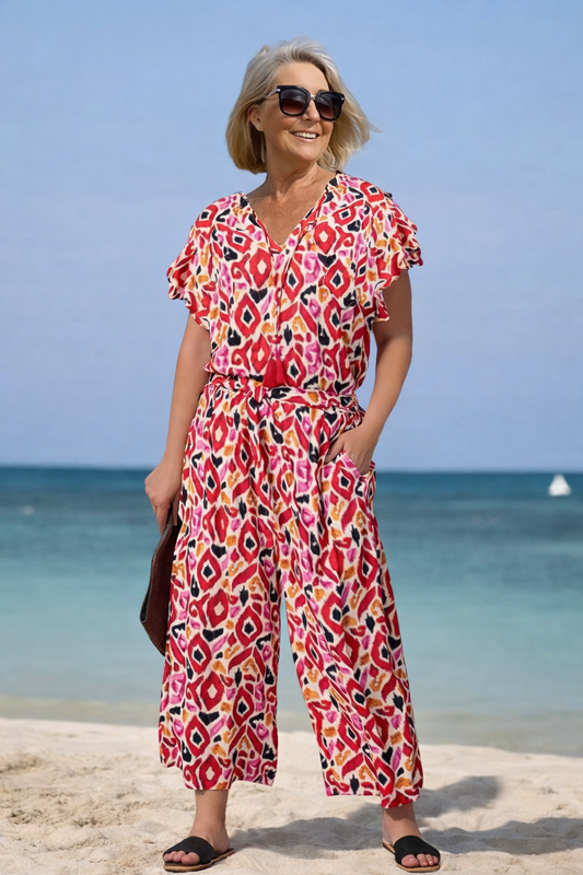 Vibrant Printed V-Neck Jumpsuit by Elizabeth Ainsley