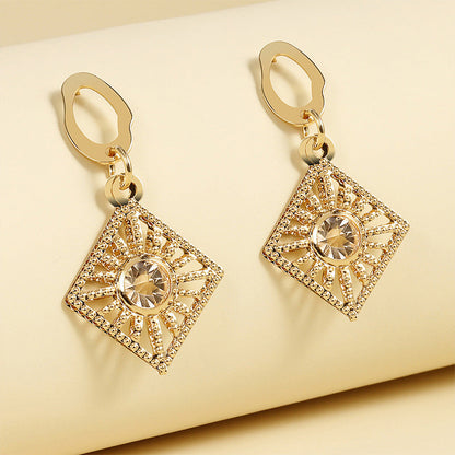 Radiant Sunburst Drop Earrings with Crystal Center